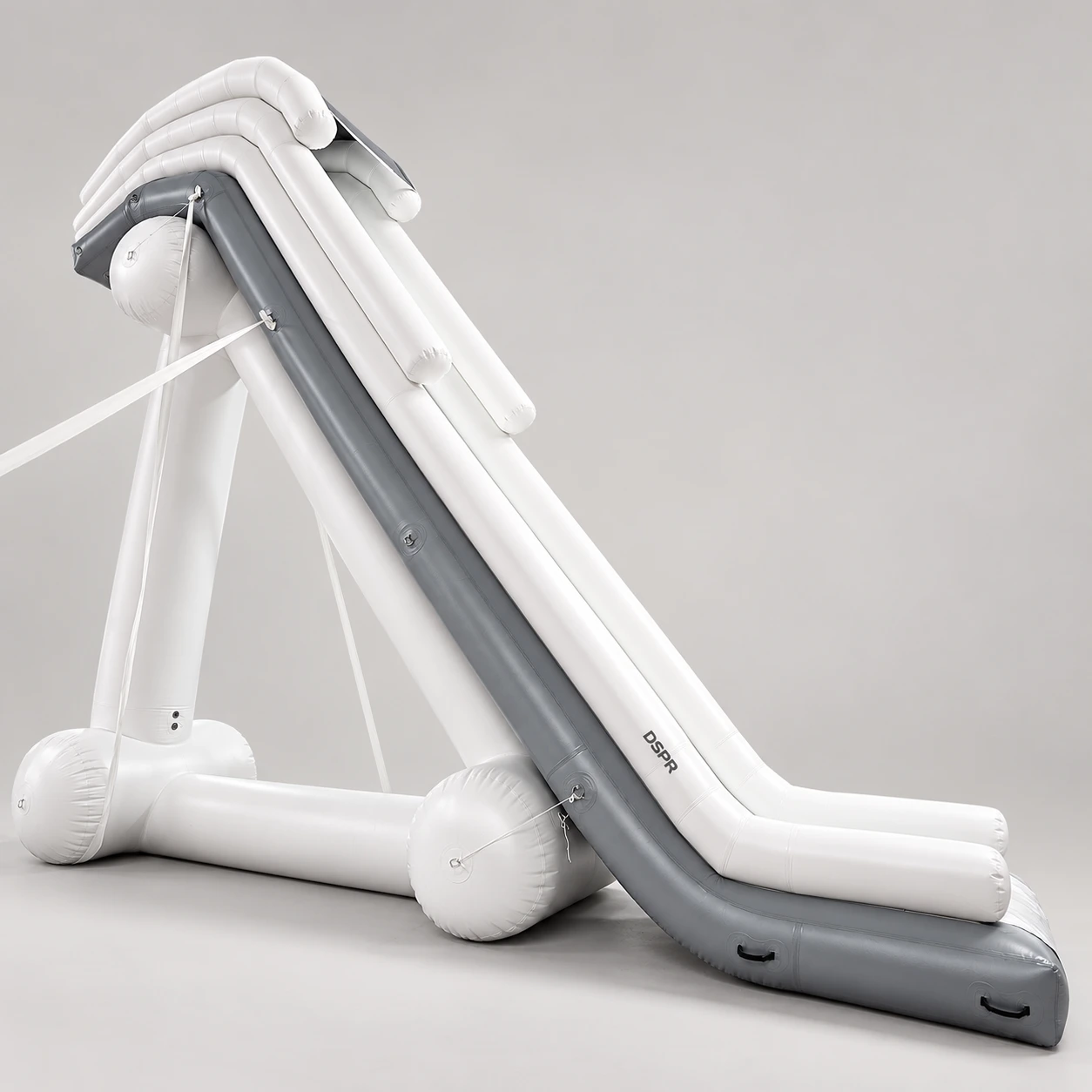 DSPR white-and-grey inflatable slide with elevated landing and rear supports